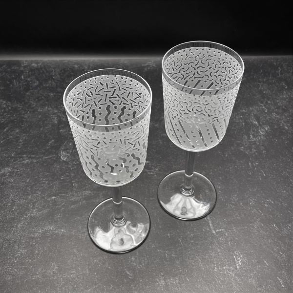 Straight Sided Wine Glasses with Sandblasted Before and After Designs Top View