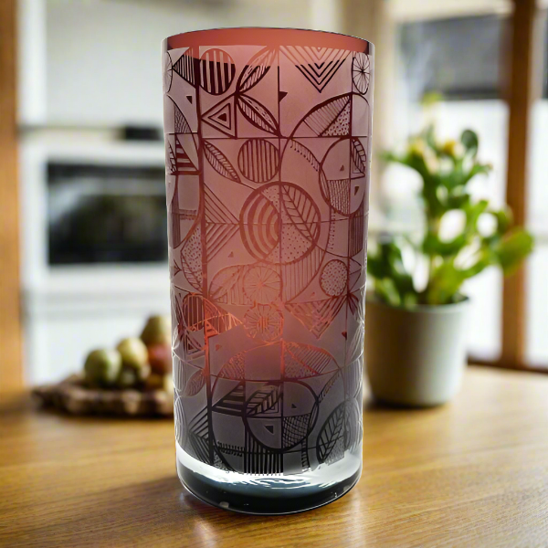 Amethyst cylinder blown glass vase with sandblasted squarely geometric design  in  kitchen