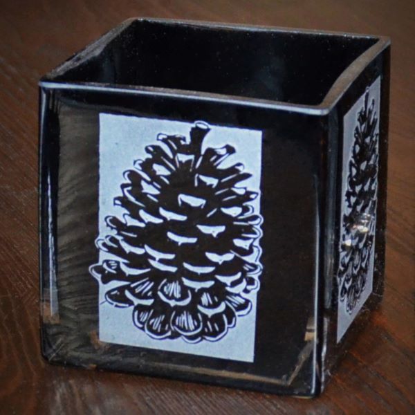 Black-blown-glass-candle-holder-with-pinecone_2-design-its-A-Blast-Glass-Tucson