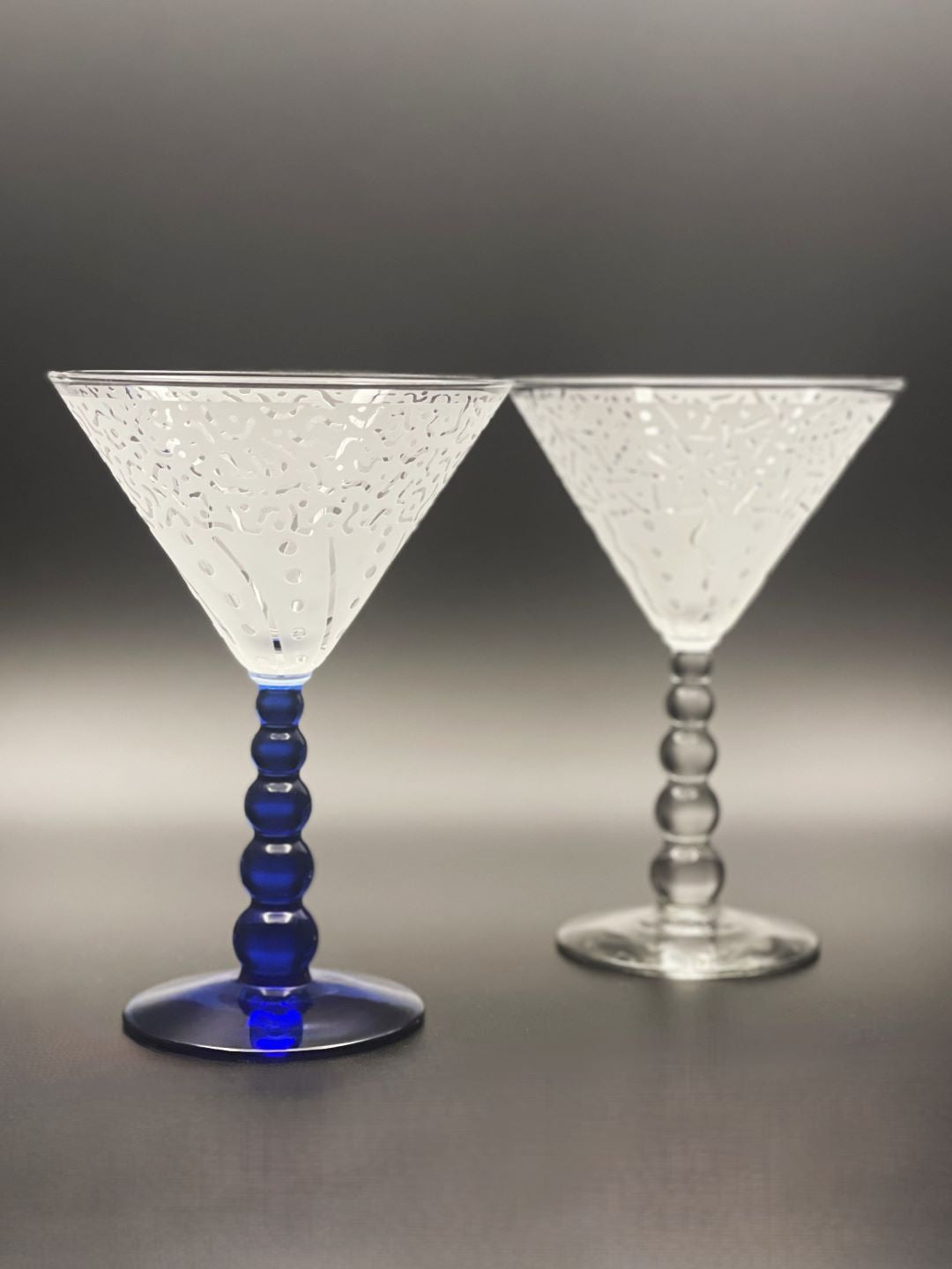 Blue and clear bubble stem cocktail glass with Befroe and After design 