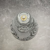 Clear-blown-glass-oil-lamp-with-sasnblasted-Spiraling-Out-of-Control-design-overhead-view