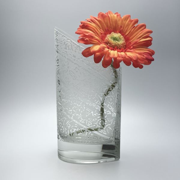 Clear-slanted-teardrop-crystal-vase-with-sandblasted-doodle-bands-side-view-with-flowers-Its-A-Blast