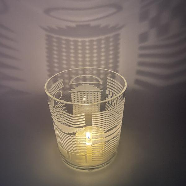 German-flared-crystal-candle-holder-with-sandblasted-geometrics-design-side-view-with-candle