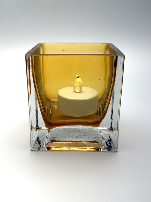 Gold square hand blown glass candle holder side view with candle   