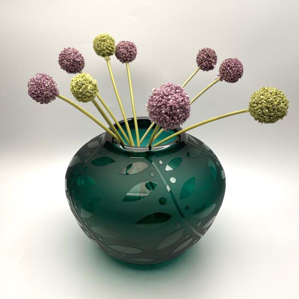 Green hand blown blass vase side view with sandblasted Leaf it to You design and flowers 