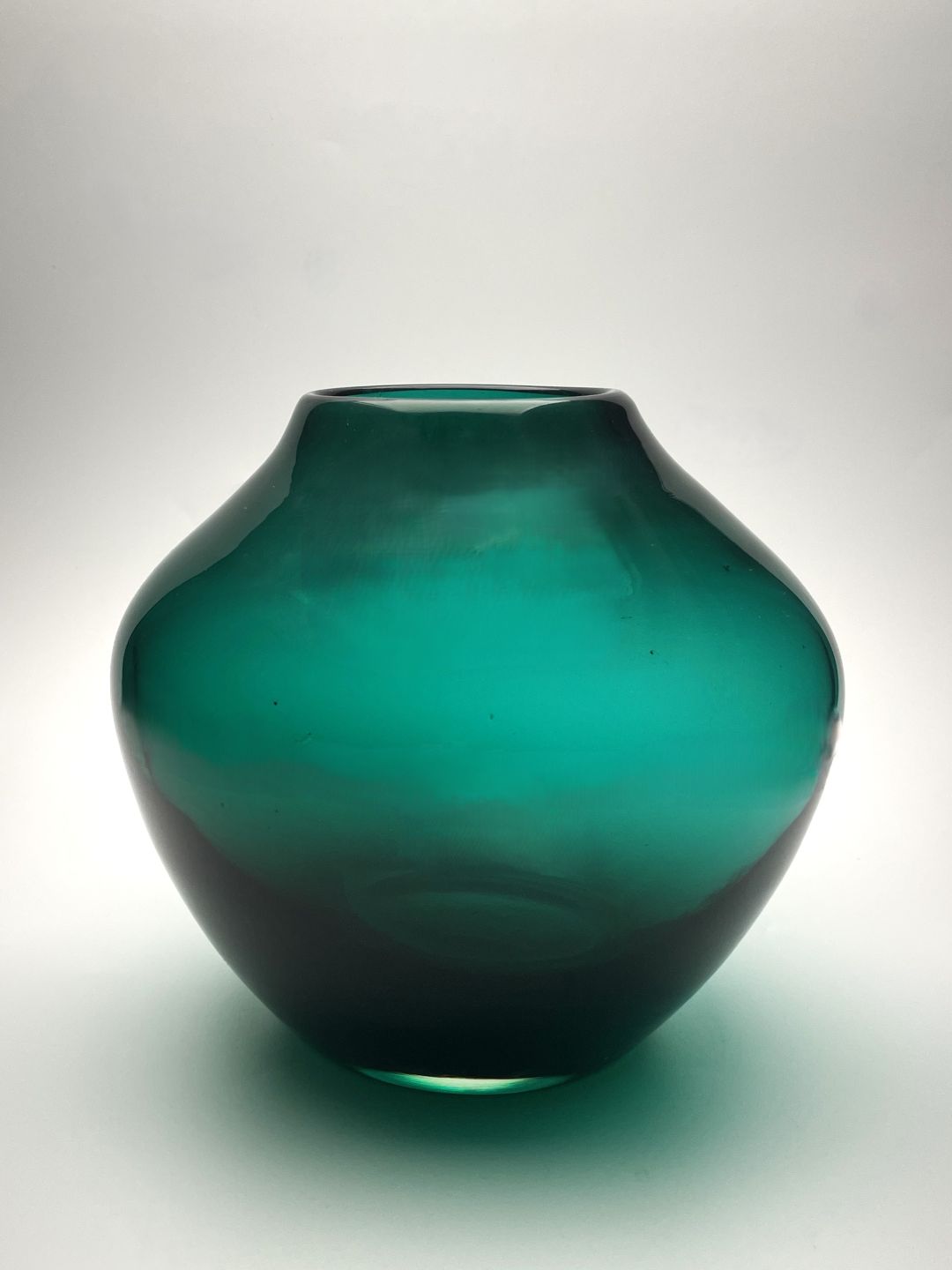 Green hand blown glass vase side view 