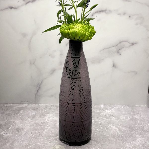 Purple-handblown-glass-bottle-with-banded-contempo-design-with-flowers