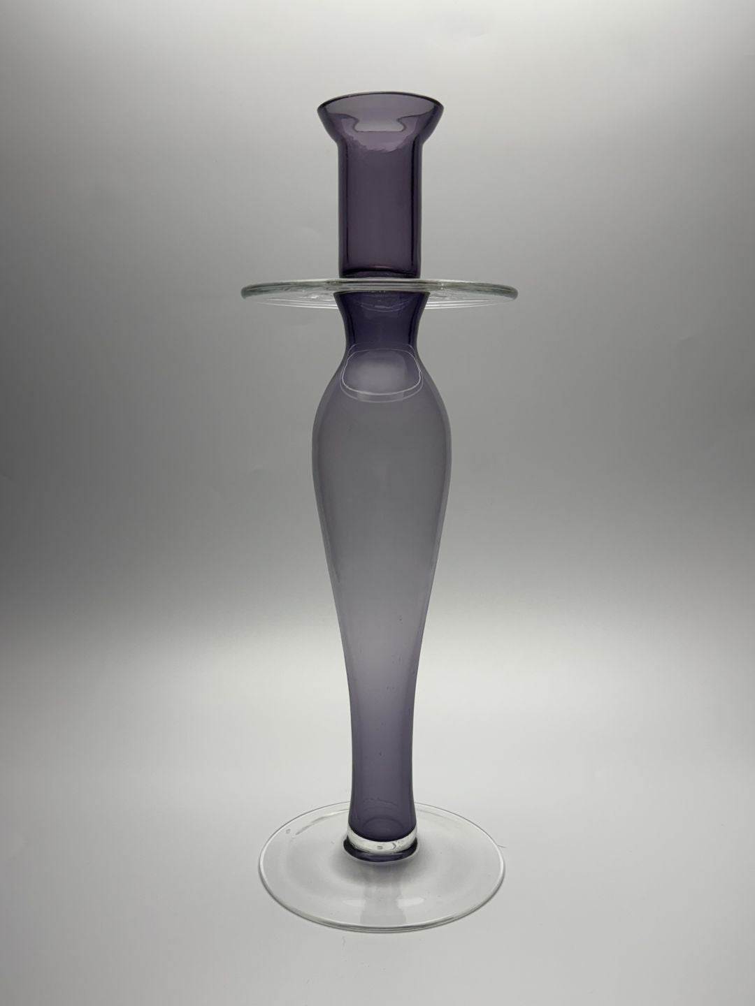 Purple tapered hand blown glass candle holder side view