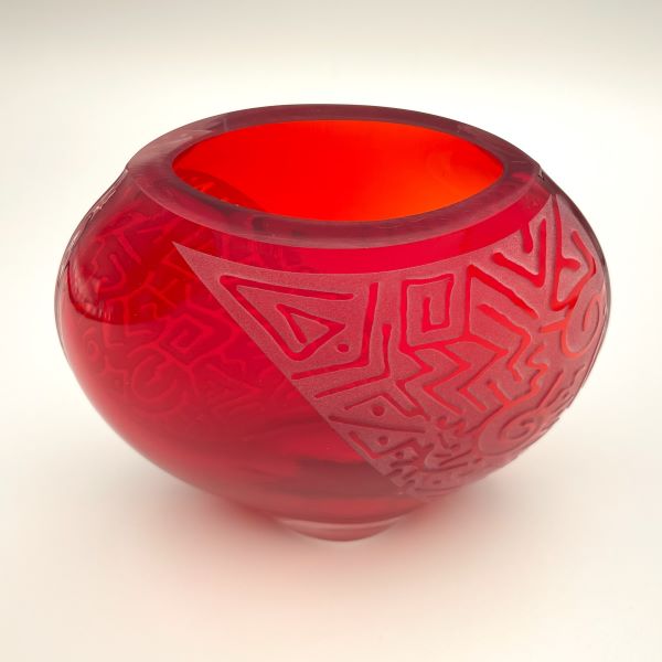 Red medium flat round glass vase with sandblasted Geo Abstract design top view 