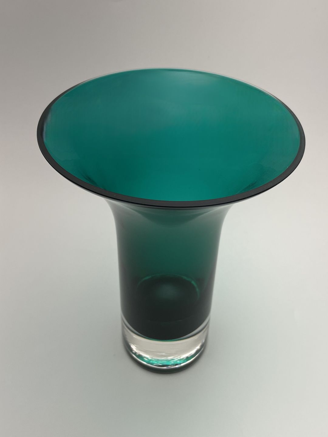 Teal green flared hand blown glass vase side view 