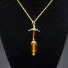 Gold and Black Glass Bead Pendant and Chain on Stand