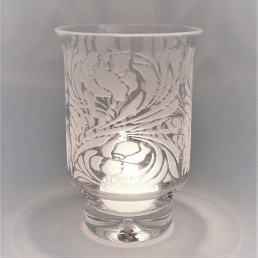 Clear-contempo-hand-blown-glass-candle-holder-with-sandblasted-Iris-design-with-lit-candle