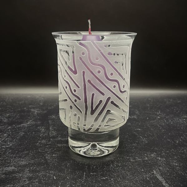 Clear-contempo-hand-blown-glass-candle-holder-with-Chama-design-side-view-with-purple-candle