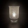Clear-contempo-hand-blown-glass-candle-holder-with-Chama-design-side-view-with-candle