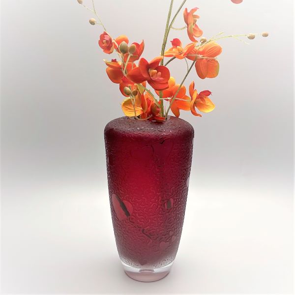 Red-handblown-glass-vase-with-sandblasted-hearts-abound-design-with-flowers