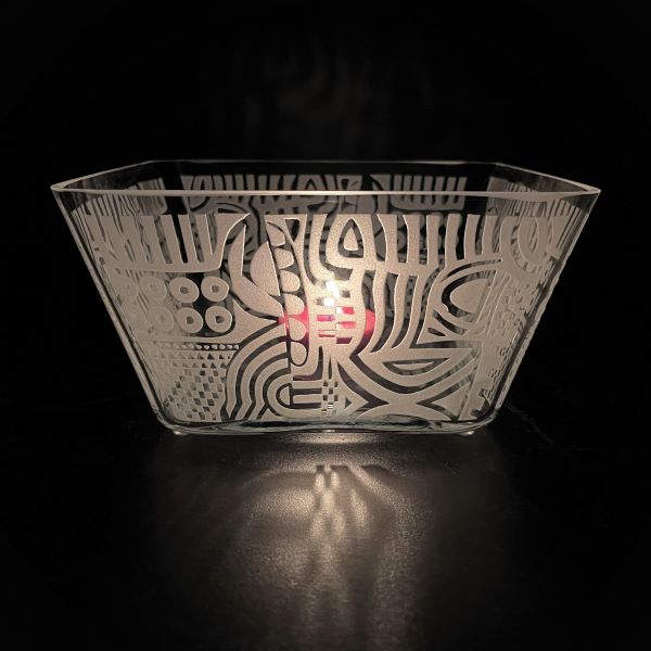 Square handblown glass bowl with sandblasted tribal abstract design with candle side view