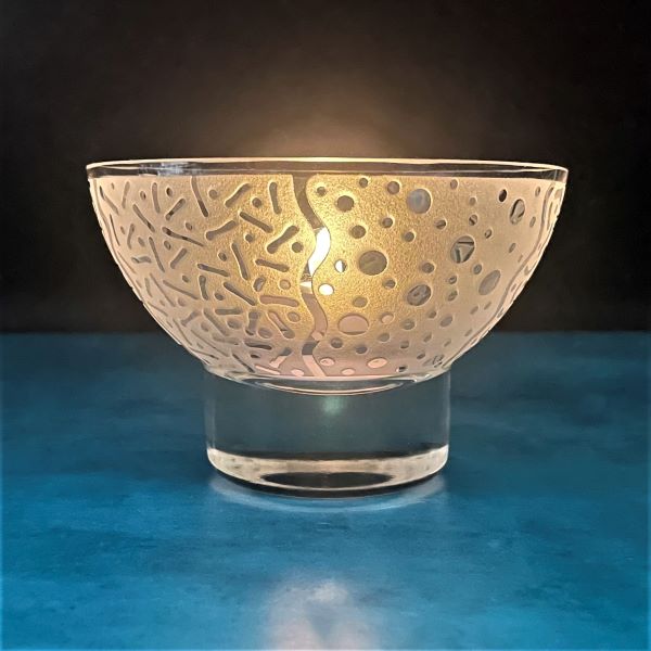 Clear-small-all-purpose-bowl-with-sandblasted- -Squiggle-Dots-Lines-Oh-My-design-side-view-with-candle